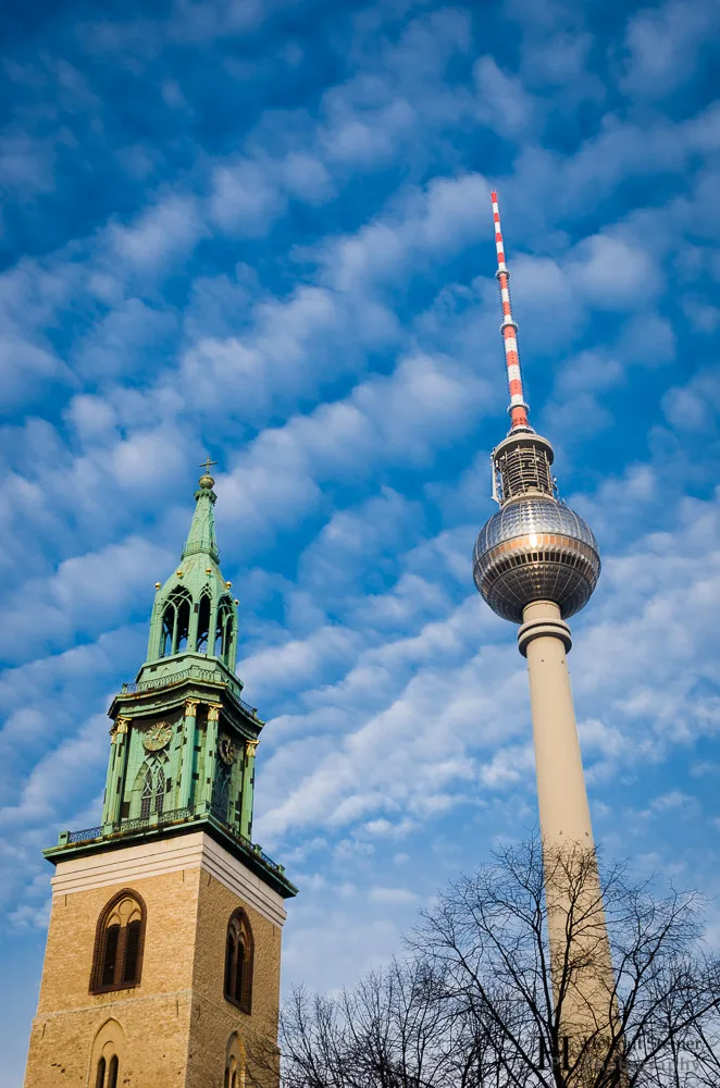 Bell tower of a church and the tv tower of Berlin