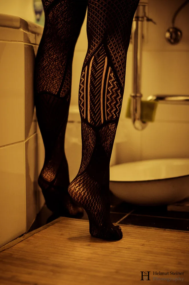 Legs of a young woman in stockings.