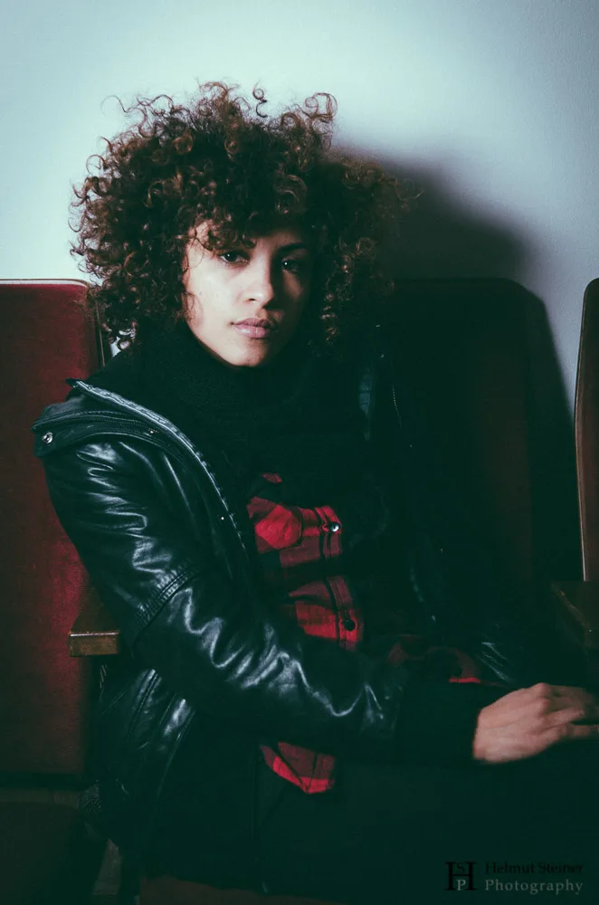 Portrait of a young woman with curly hair