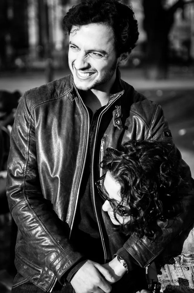 Young girl in a playful headlock given by her boyfriend