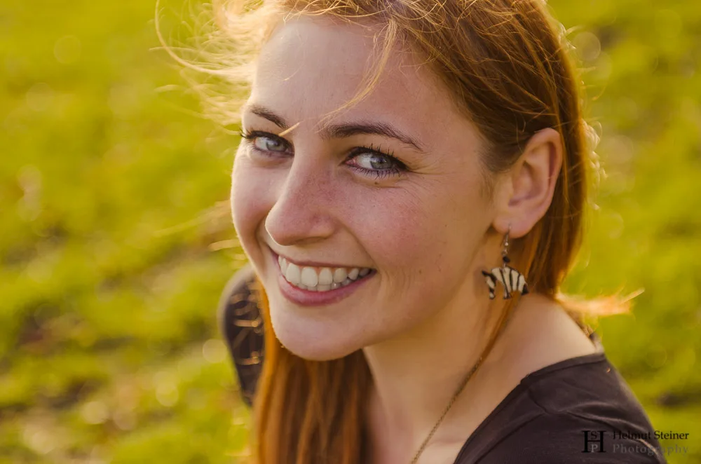 Portrait of a Young Girl with Red Hair Smiling