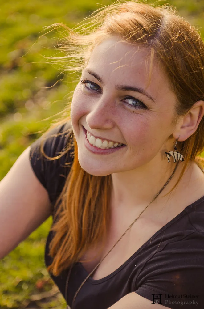 Portrait of a Young Girl with Red Hair Smiling
