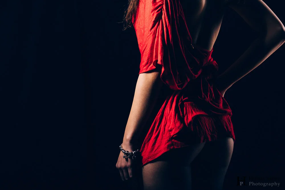 Young woman's back, red dress