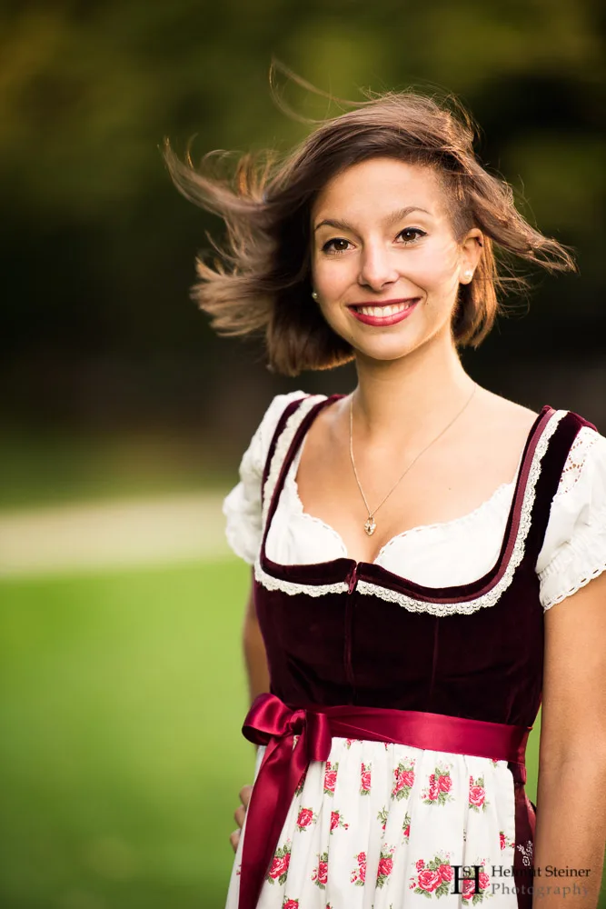 Portrait of a dark haired young girl in a traditional German/Austrian dress (called Dirndl)